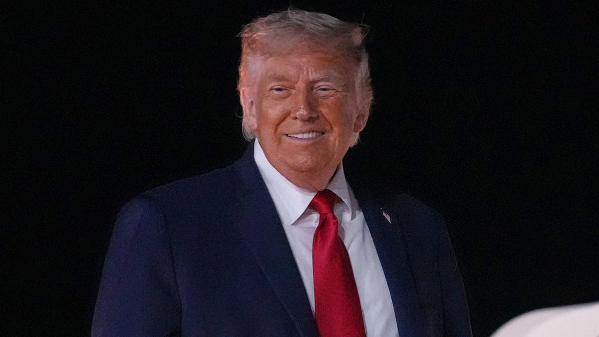 President Donald Trump boarding Air Force One at John F Kennedy International Airport