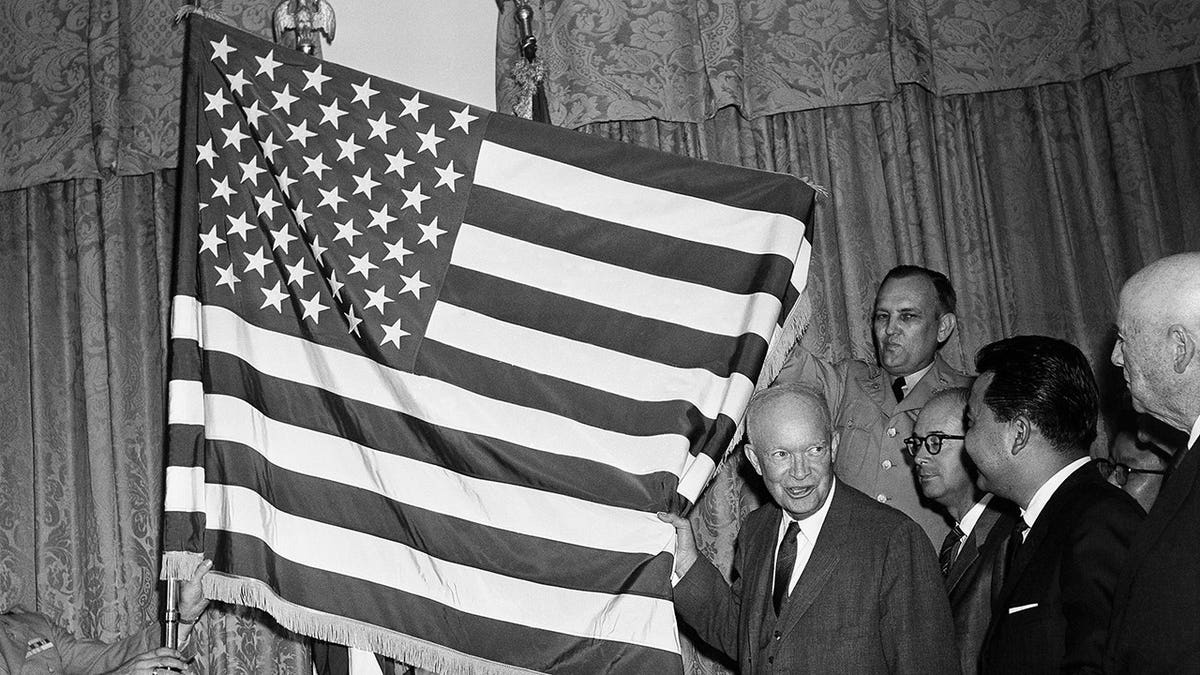 President Eisenhower with the American flag