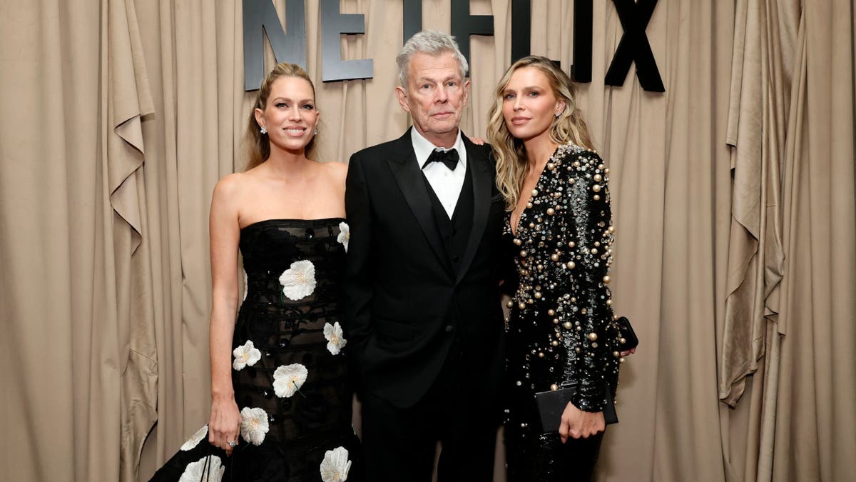 Erin Foster, David Foster, and Sara Foster posing together at an event in Beverly Hills