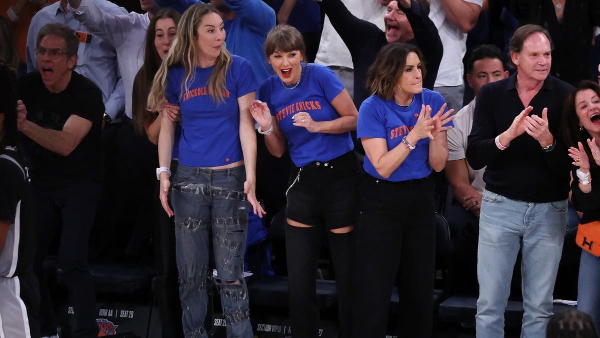 Este Haim, Taylor Swift, and Mariska Hargitay reacting during NBA Finals game at Madison Square Garden
