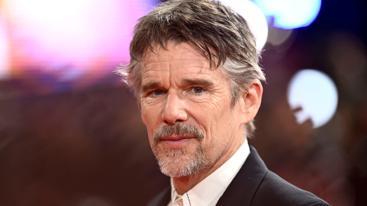 Ethan Hawke standing in a dark suit at the Blue Moon Headline Gala in London