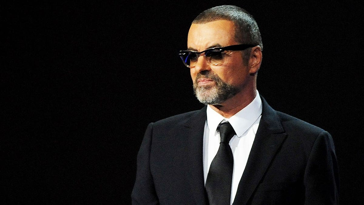 George Michael presenting on stage at the BRIT Awards in London