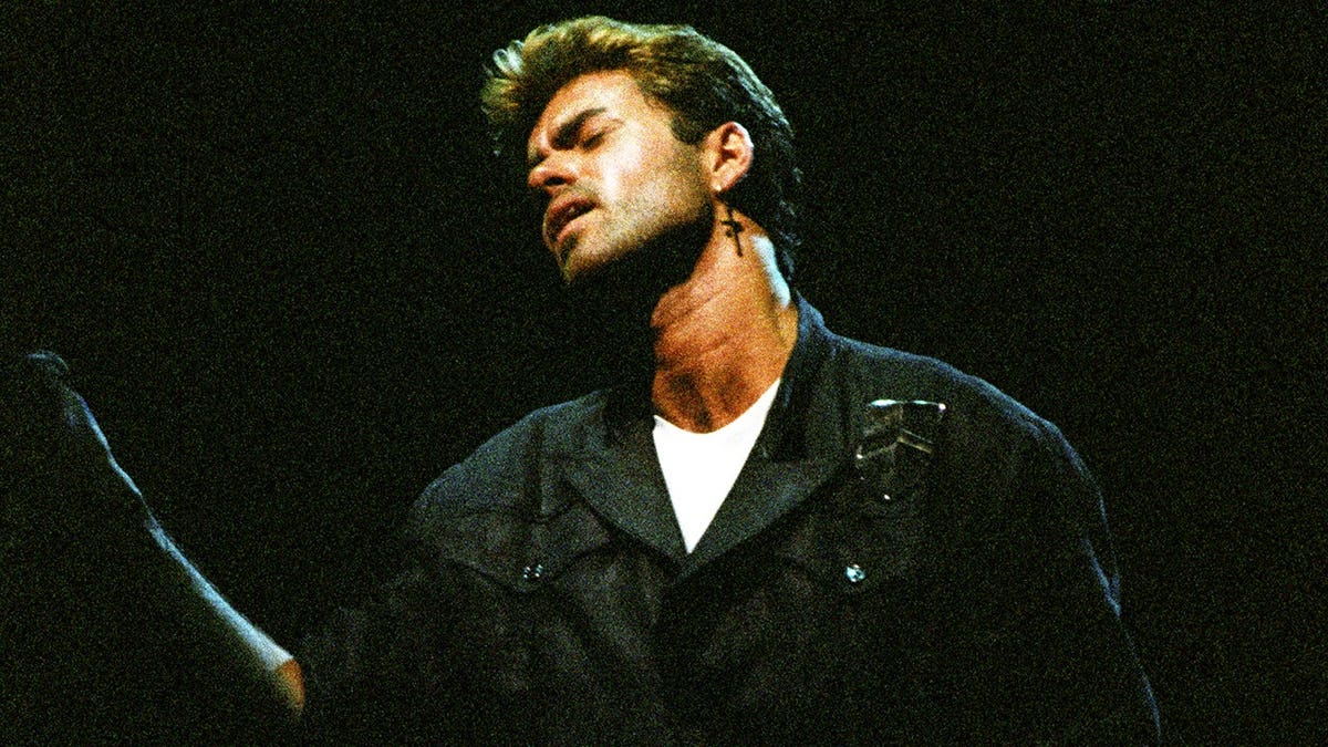 George Michael performing on stage at Earls Court Arena in London