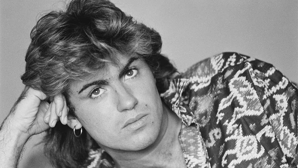 British singer-songwriter George Michael sitting in a Sydney hotel room.