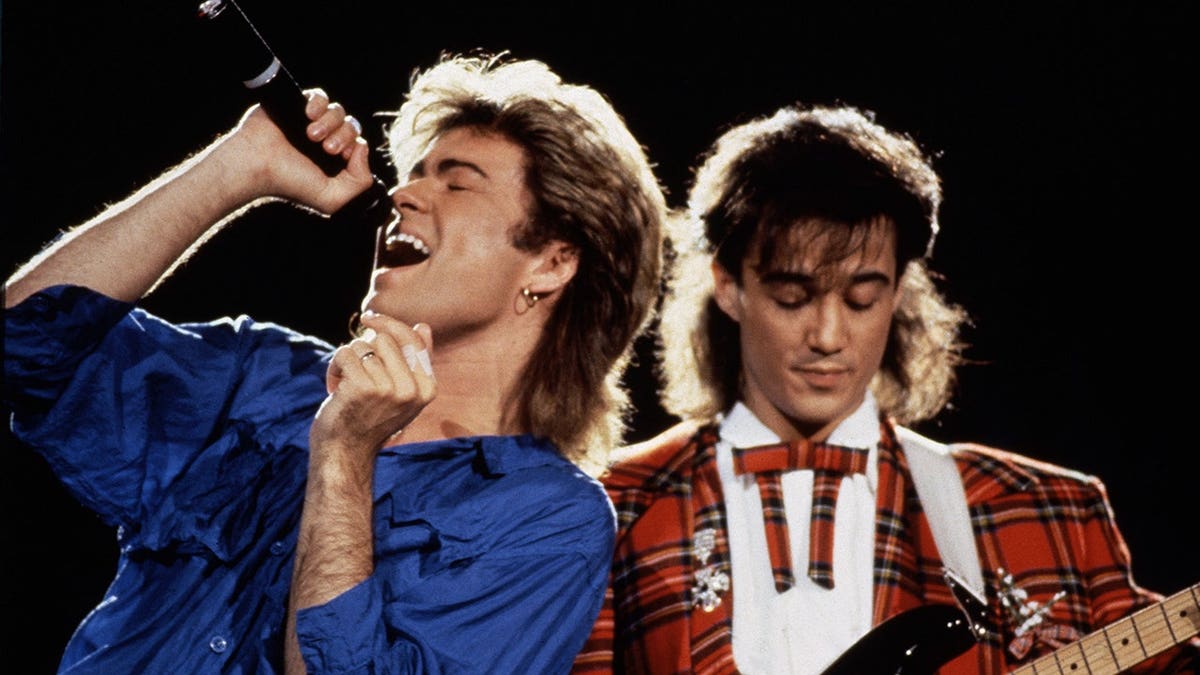 George Michael and Andrew Ridgeley performing on stage in Japan