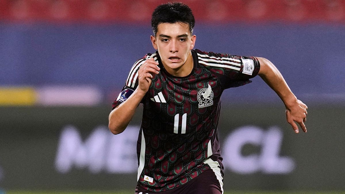 Mexico's Gilberto Mora controlling the ball during a soccer match at National Stadium in Santiago
