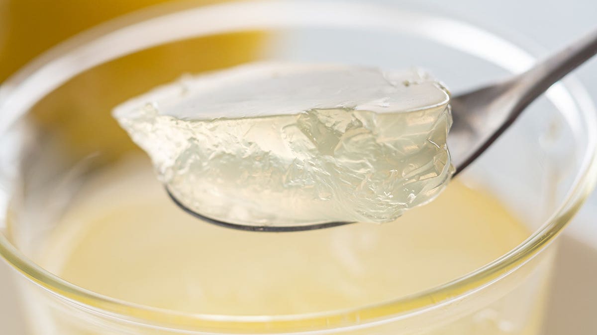 Honey lemon jelly in a clear glass bowl.