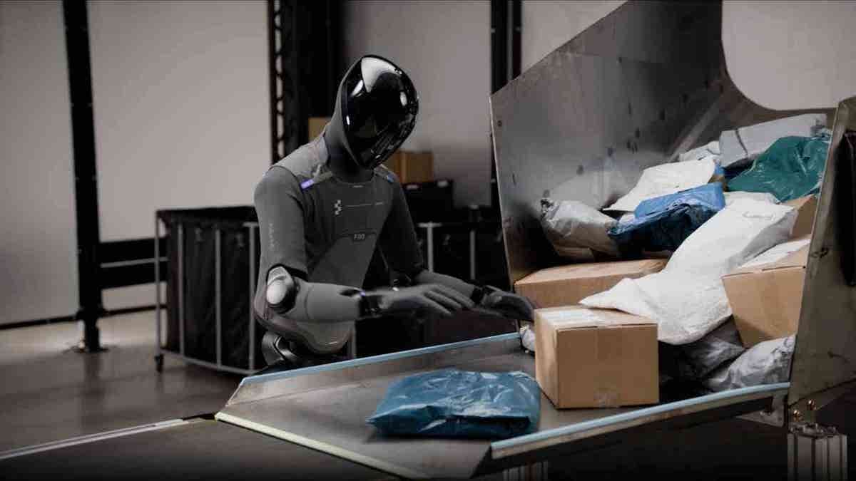 A humanoid robot packing boxes