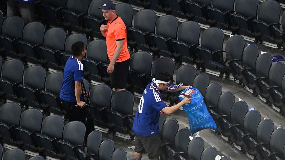 Japan fans cleaning up   trash successful  a stadium aft  a World Cup shot    lucifer  successful  Arlington, Texas.