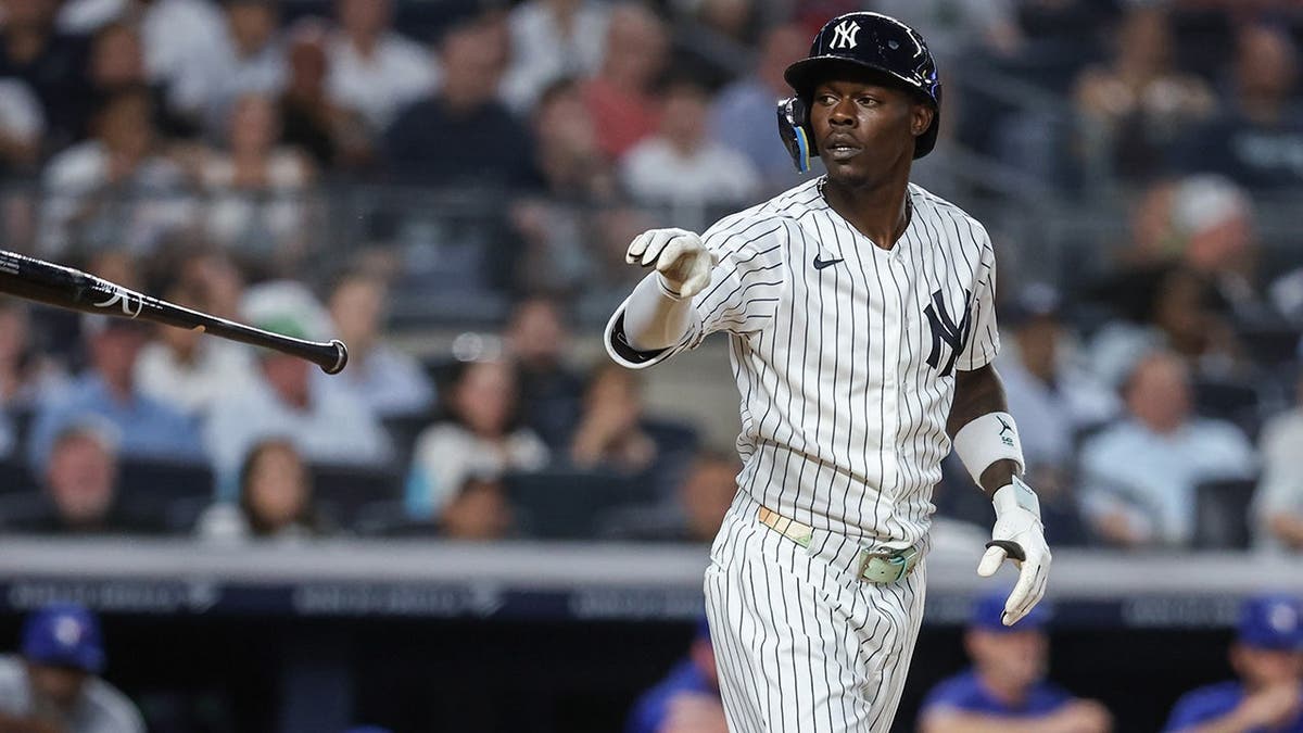 New York Yankees second baseman Jazz Chisholm Jr. flipping his bat at Yankee Stadium