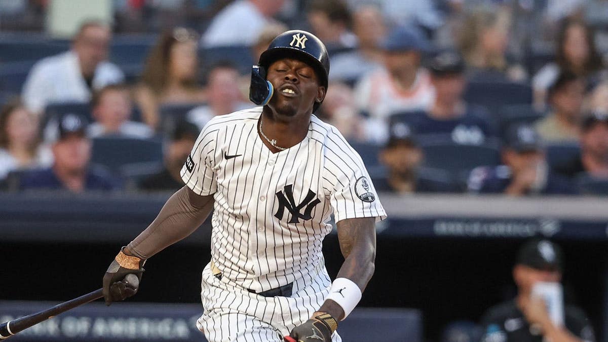 New York Yankees second baseman Jazz Chisholm Jr. reacts after hitting himself with a foul ball at Yankee Stadium