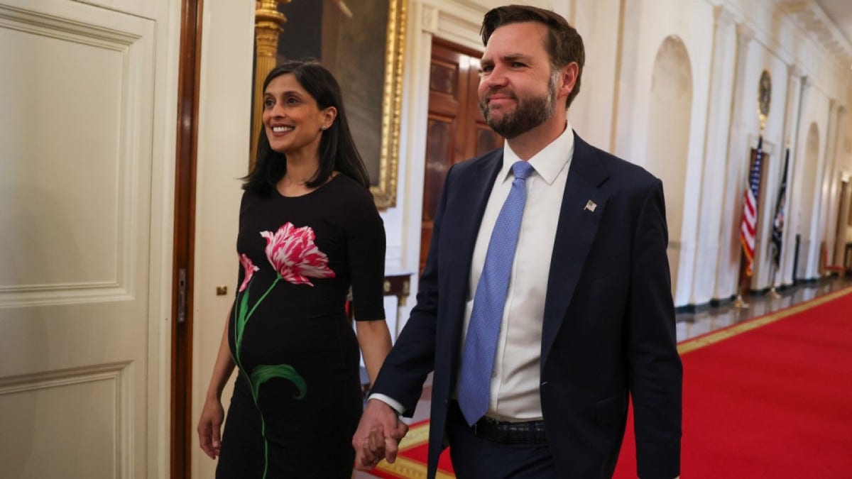 Second lady Usha Vance and U.S. Vice President JD Vance arrive for a military mothers celebration in the East Room of the White House on May 6, 2026 in Washington, DC.
