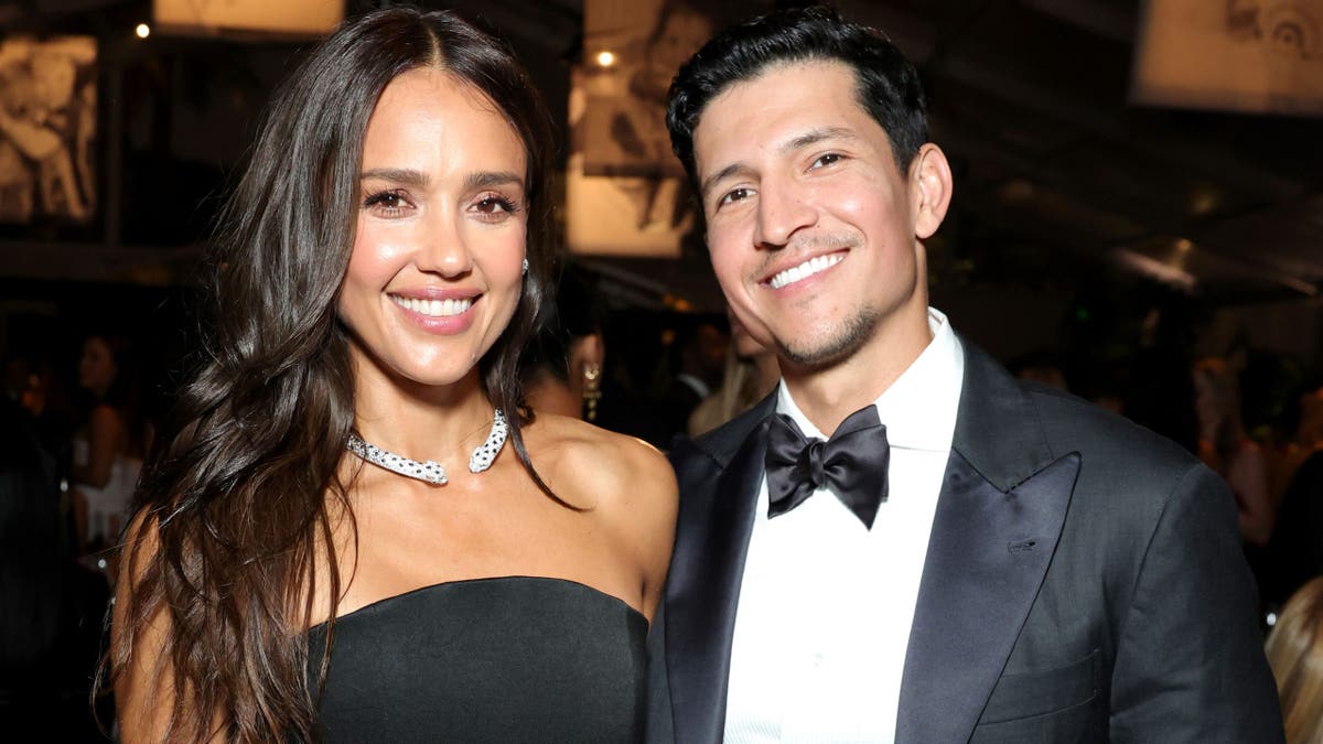 Jessica Alba and Danny Ramirez smile while at Baby2Baby Gala in 2025