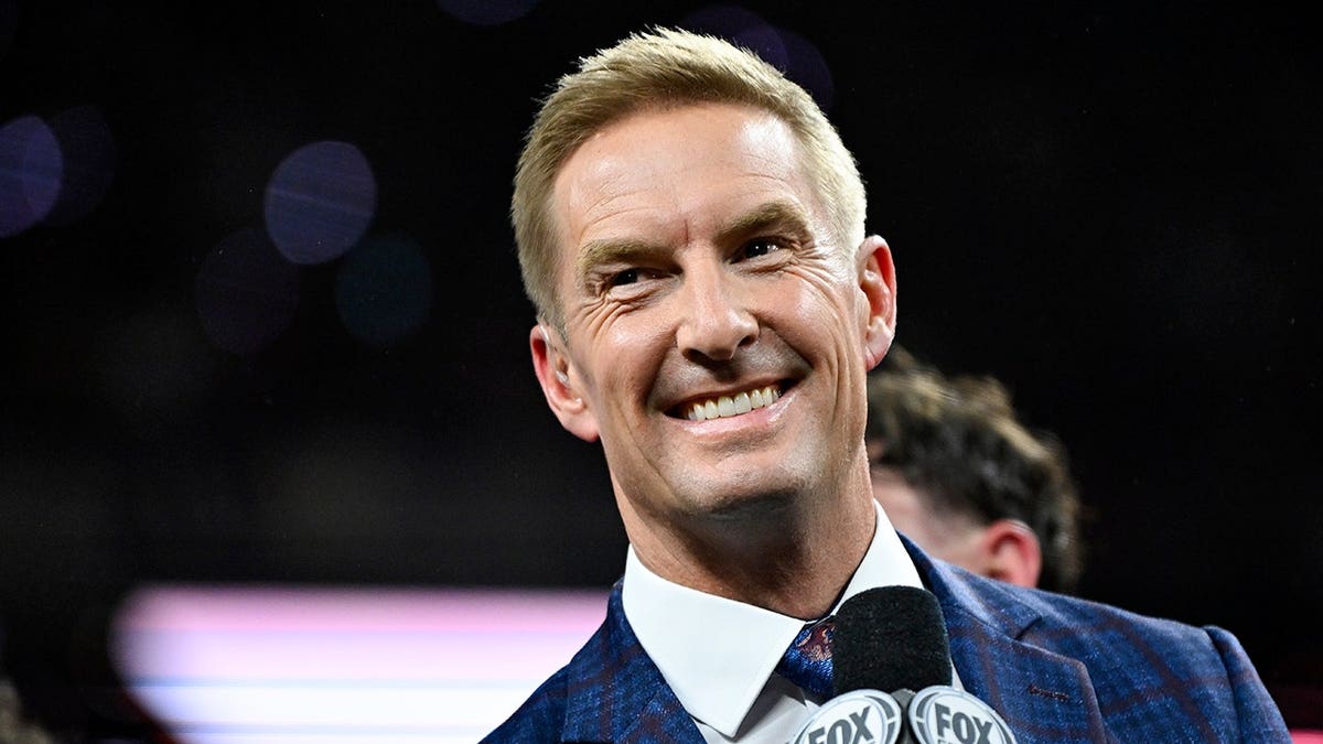 Fox Sports Football Analyst Joel Klatt broadcasting during trophy presentation at Lucas Oil Stadium