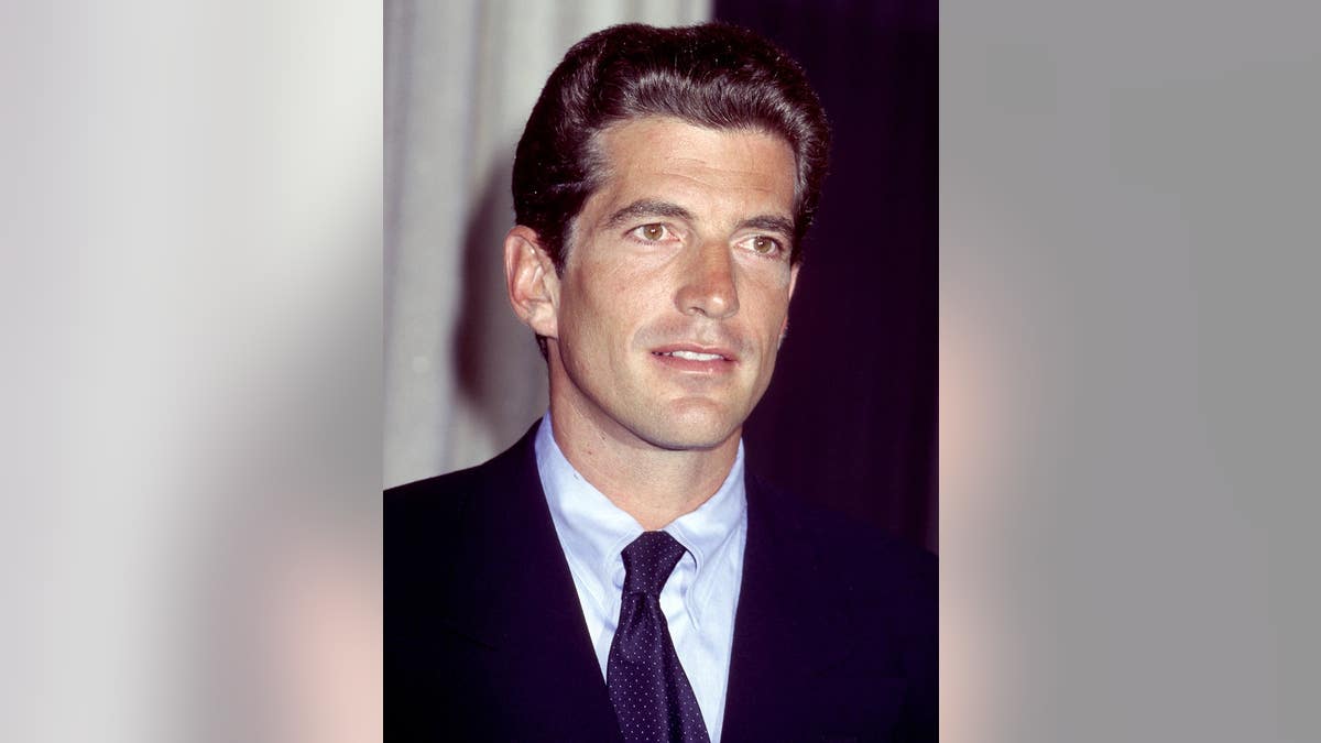 John F. Kennedy Jr. posing for a portrait