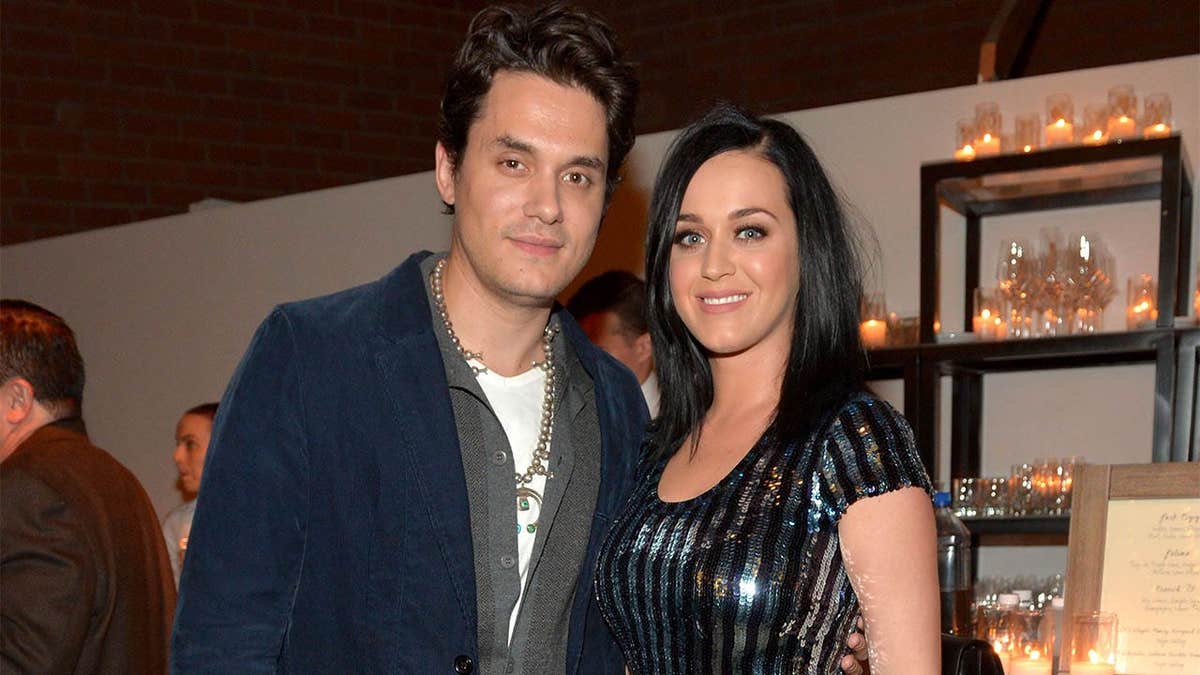 Musician John Mayer and singer Katy Perry standing together at an event in Culver City, California.