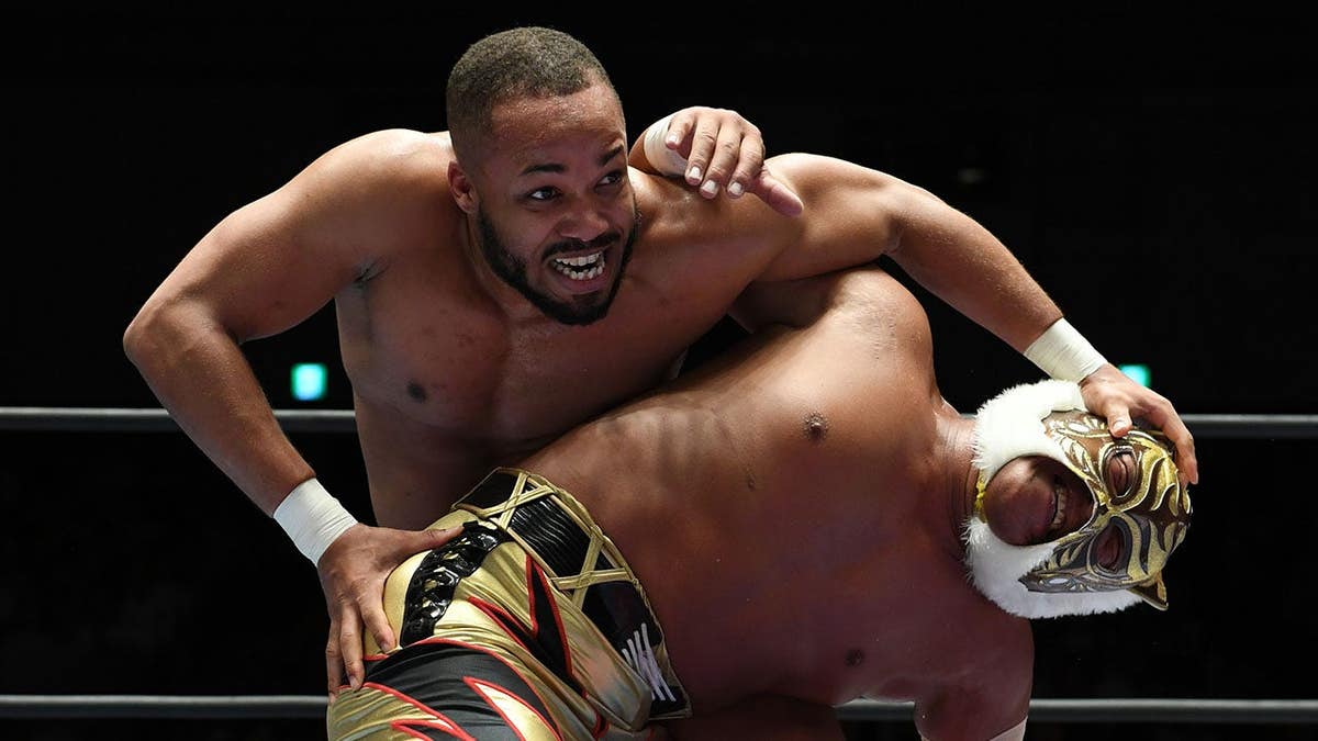 Jonathan Gresham and Tiger Mask wrestling in a ring at Korakuen Hall in Tokyo