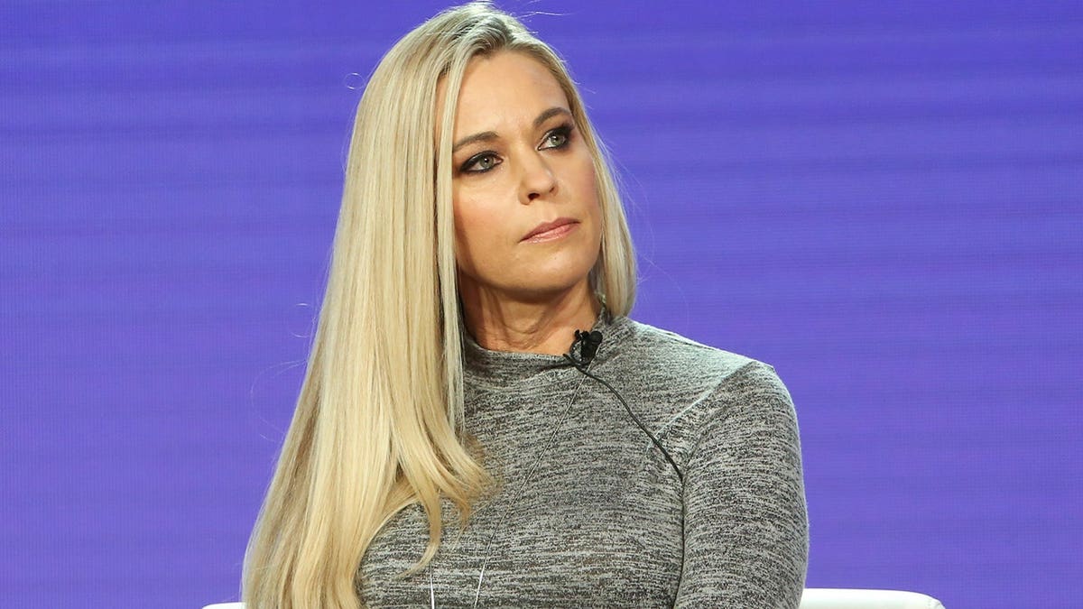Kate Gosselin in a gray long sleeve dress while speaking at a panel in Los Angeles in February 2019.