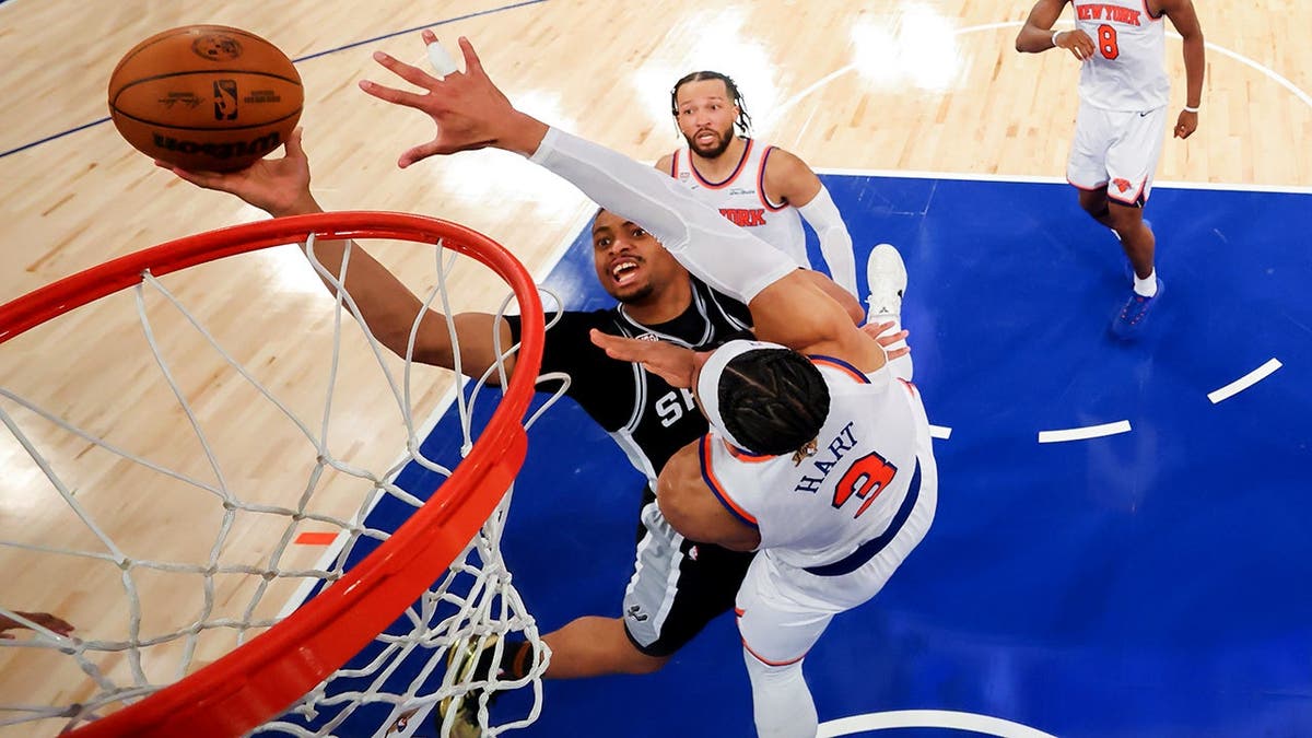San Antonio Spurs guardant  Keldon Johnson shooting arsenic  New York Knicks defender  Josh Hart defends successful  hoops  game