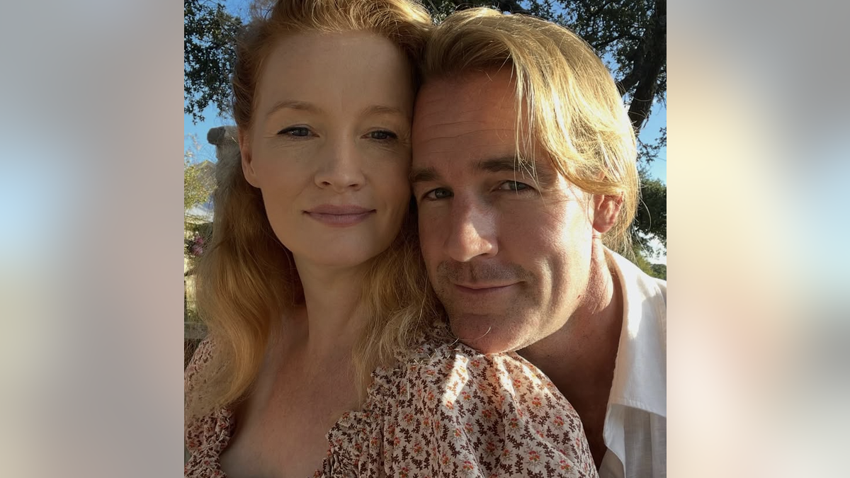 A closeup of Kimberly and James Van Der Beek