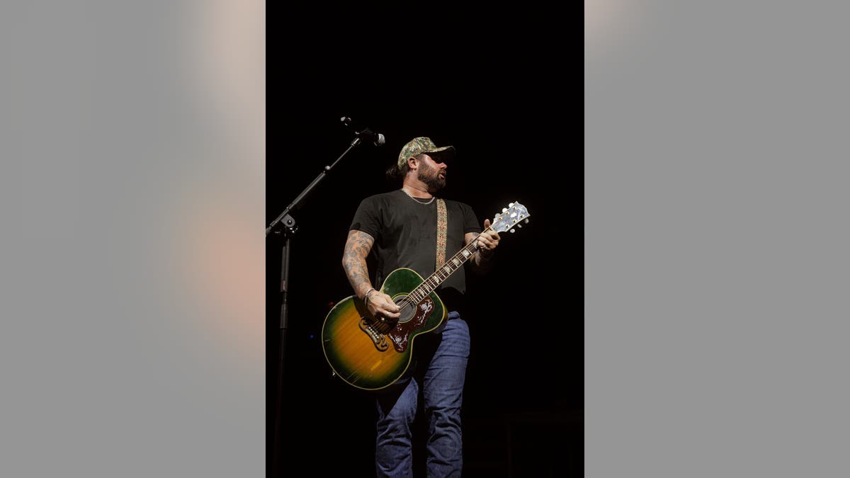 Koe Wetzel singing on stage at Moody Amphitheater during SXSW in Austin, Texas