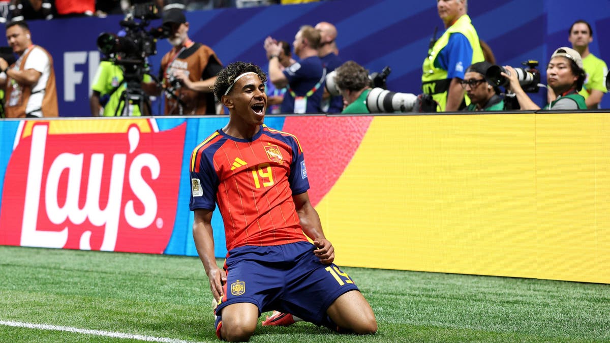 Lamine Yamal celebrating after scoring a goal during a soccer match at Atlanta Stadium