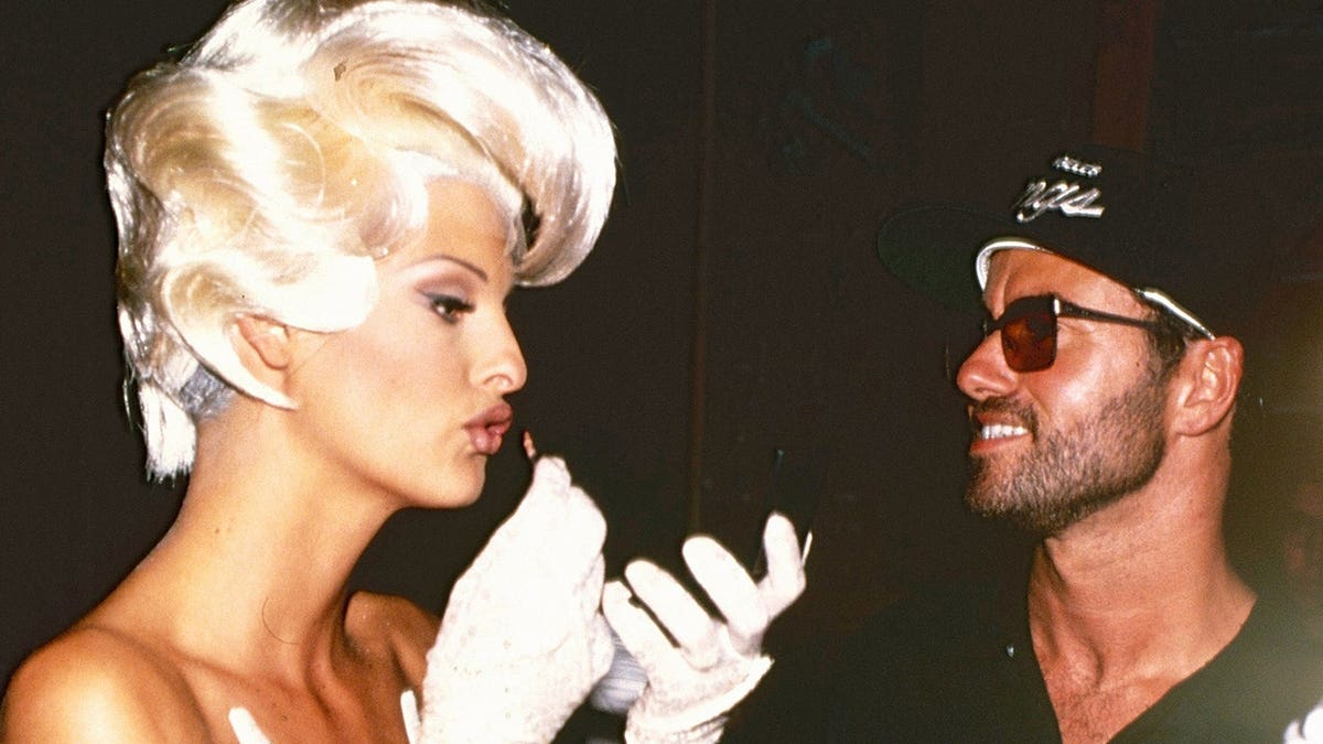 Linda Evangelista and George Michael posing during a video shoot in Paris