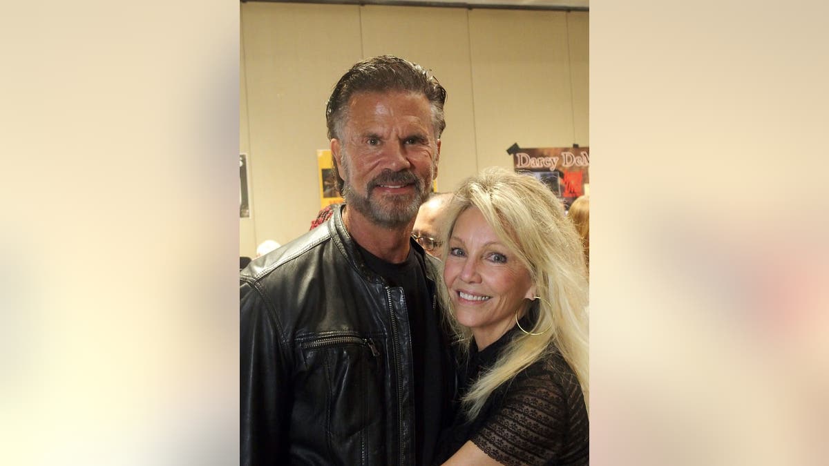 Lorenzo Lamas and Heather Locklear standing together at Chiller Theatre Expo in Parsippany, New Jersey