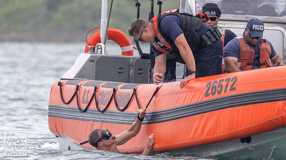 Members of the US Coast Guard and Bahamian Police Force searching waters adjacent   Hope Town