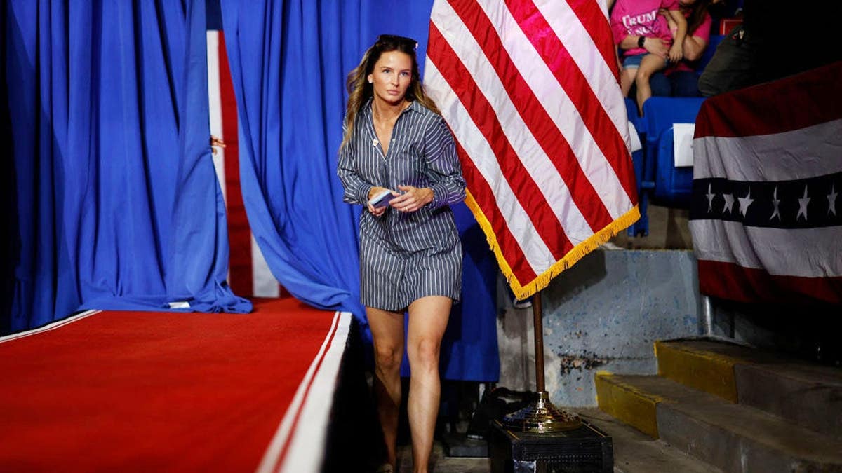 Margo Martin walking backstage during a campaign rally in Johnstown, Pennsylvania