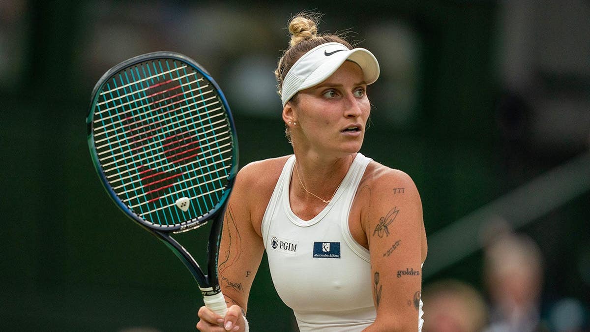 Marketa Vondrousova prepares to return a shot during a tennis match in London.