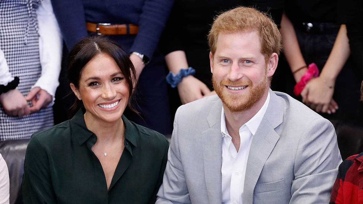 Meghan Duchess of Sussex and Prince Harry standing outside Joff Youth Centre in Peacehaven