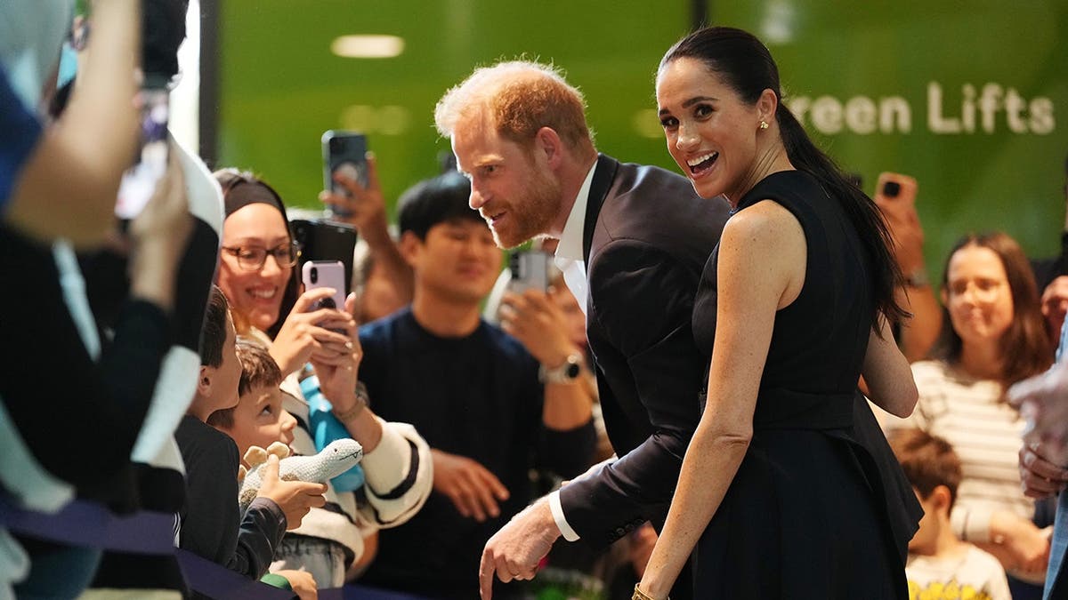 Meghan Duchess of Sussex and Prince Harry meet children and families at hospital