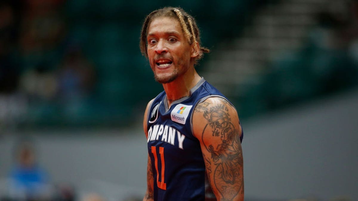 Michael Beasley wearing number 11 jersey reacting during a basketball game at Comerica Center in Frisco, Texas