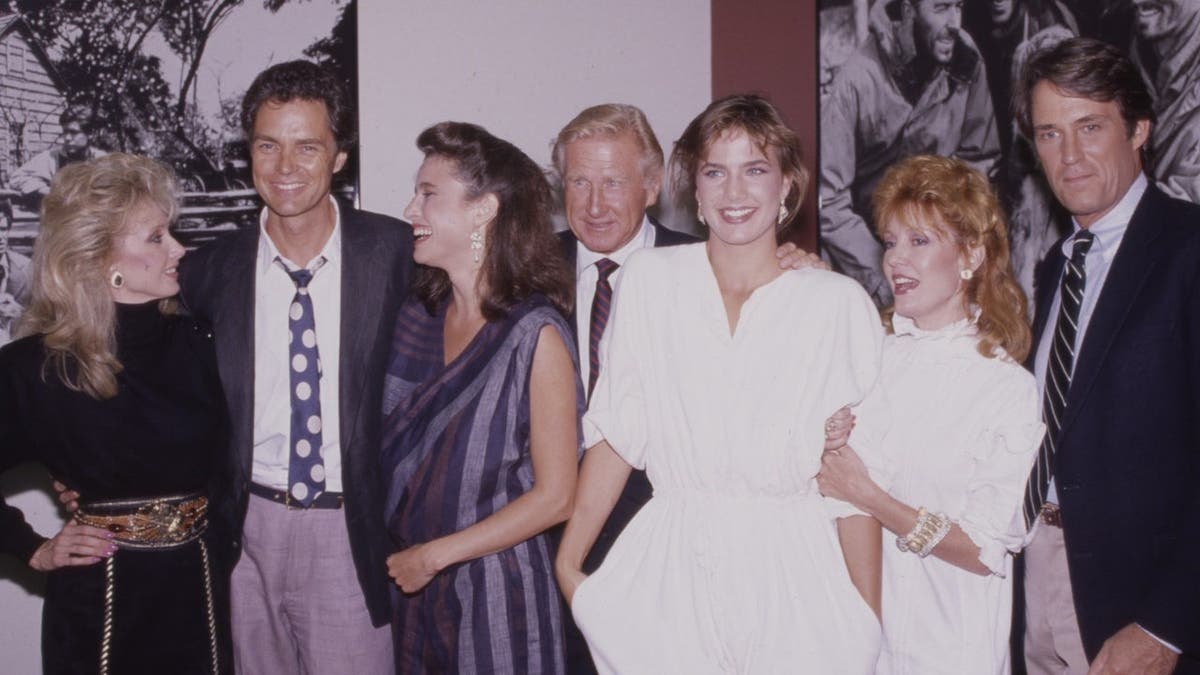 Morgan Fairchild, Richard Beymer, Mimi Rogers, Lloyd Bridges, Terry Farrell, Anne Schedeen, and John Bennett Perry pose at the wrap ceremony.