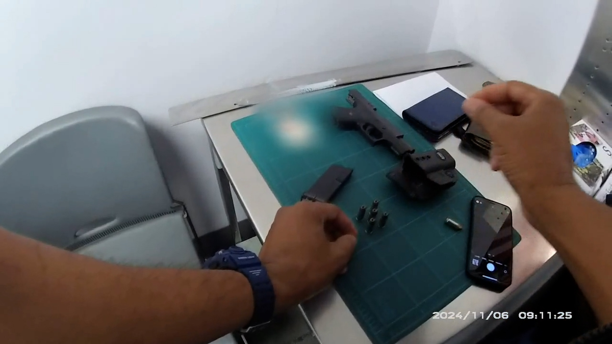 A glock handgun, mag and cartridges connected a array astatine TSA checkpoint