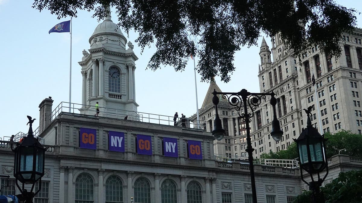 Banners hanging above City Hall in New York for Knicks NBA championship parade