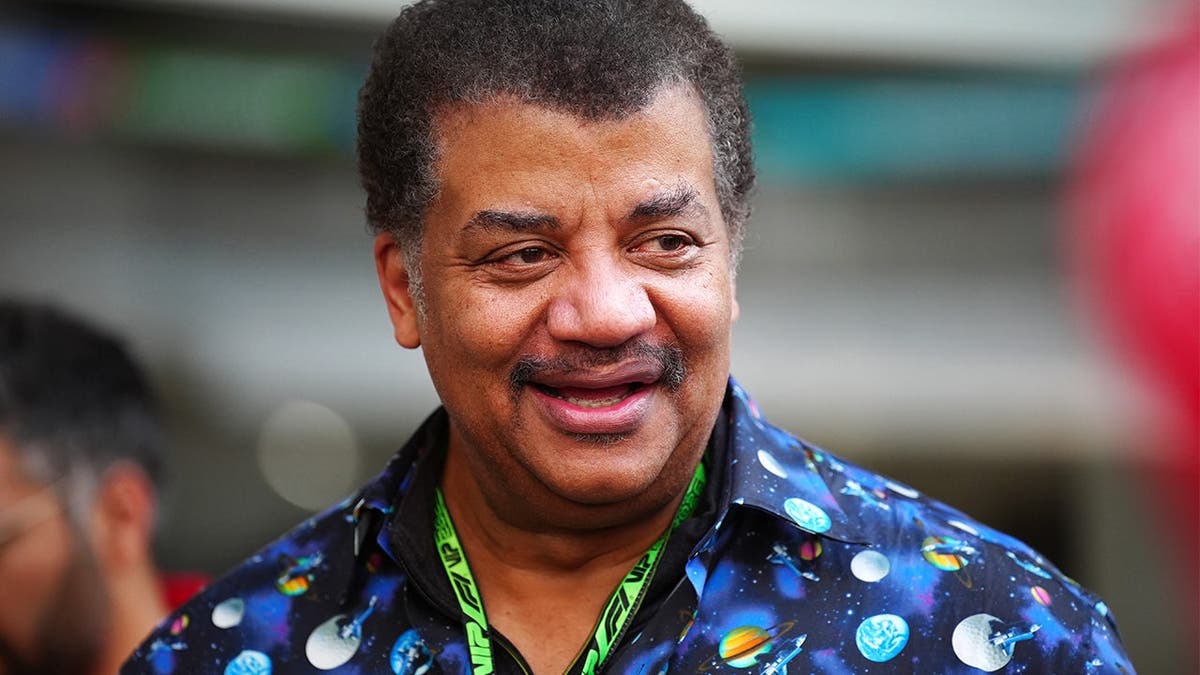 Neil deGrasse Tyson arrives at Miami International Autodrome before race.