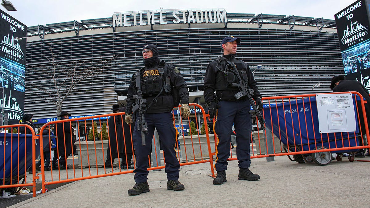 Spy law used to stop Taylor Swift attack to lapse as Congress skips town, World Cup nears New Jersey police stand outside of stadium