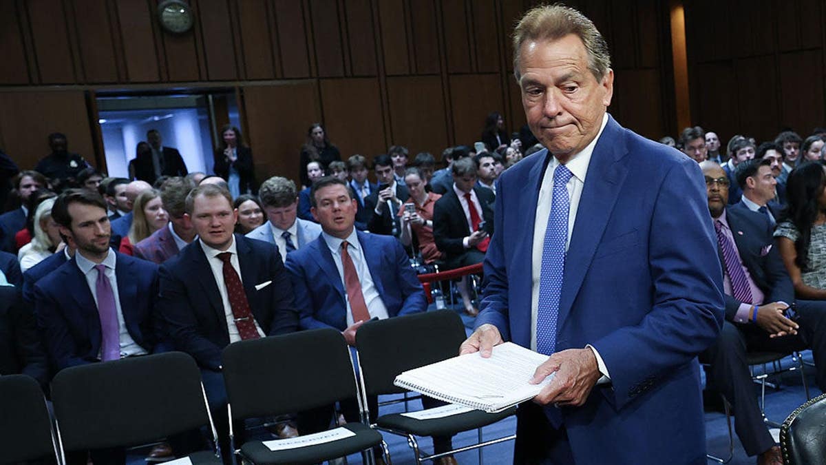 Nick Saban walking into the Hart Senate Office Building in Washington, D.C.