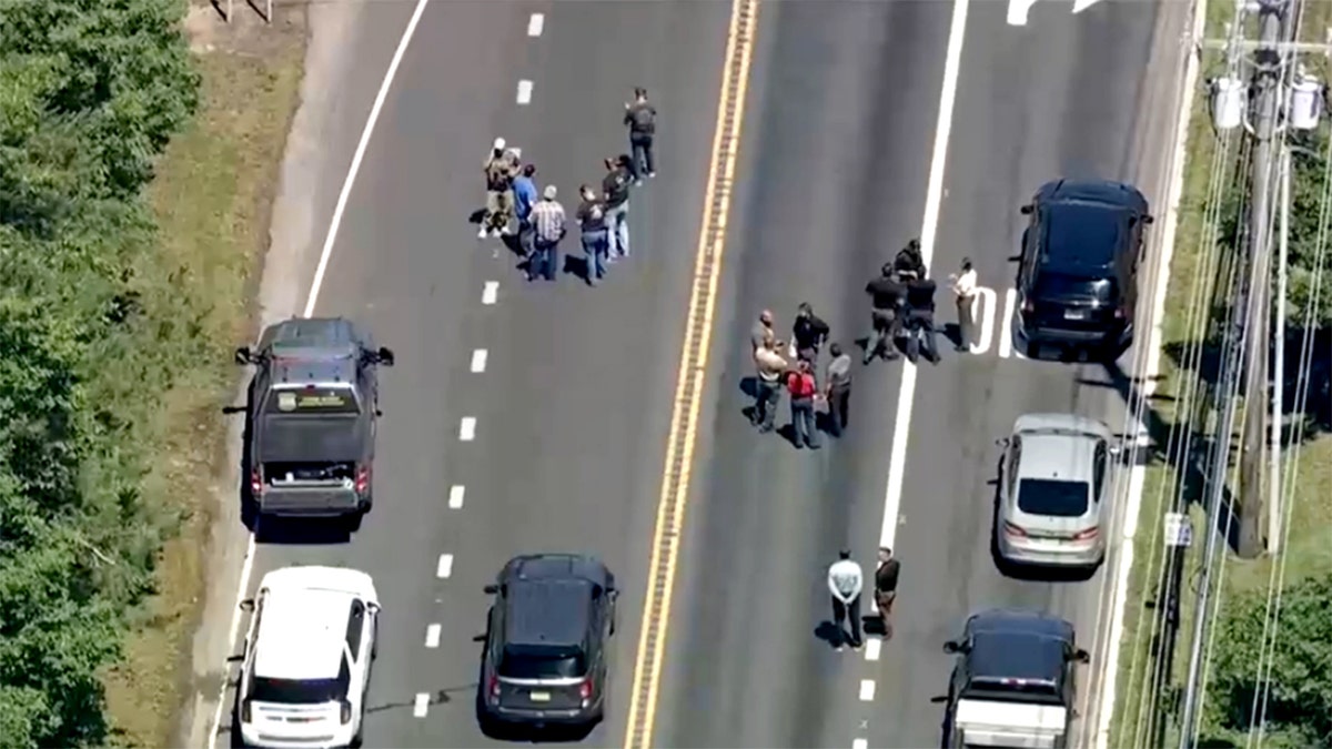 Authorities successful  the thoroughfare  with vehicles astatine  the scene