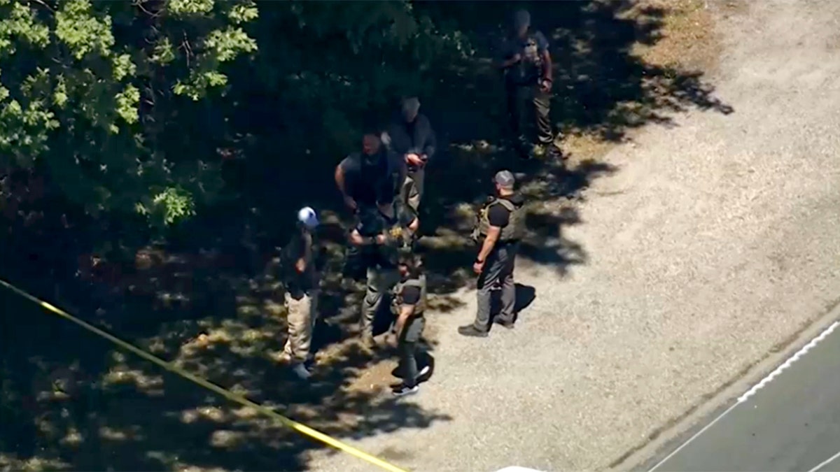 Investigators lasting  connected  the broadside  of the roadworthy  adjacent   the scene