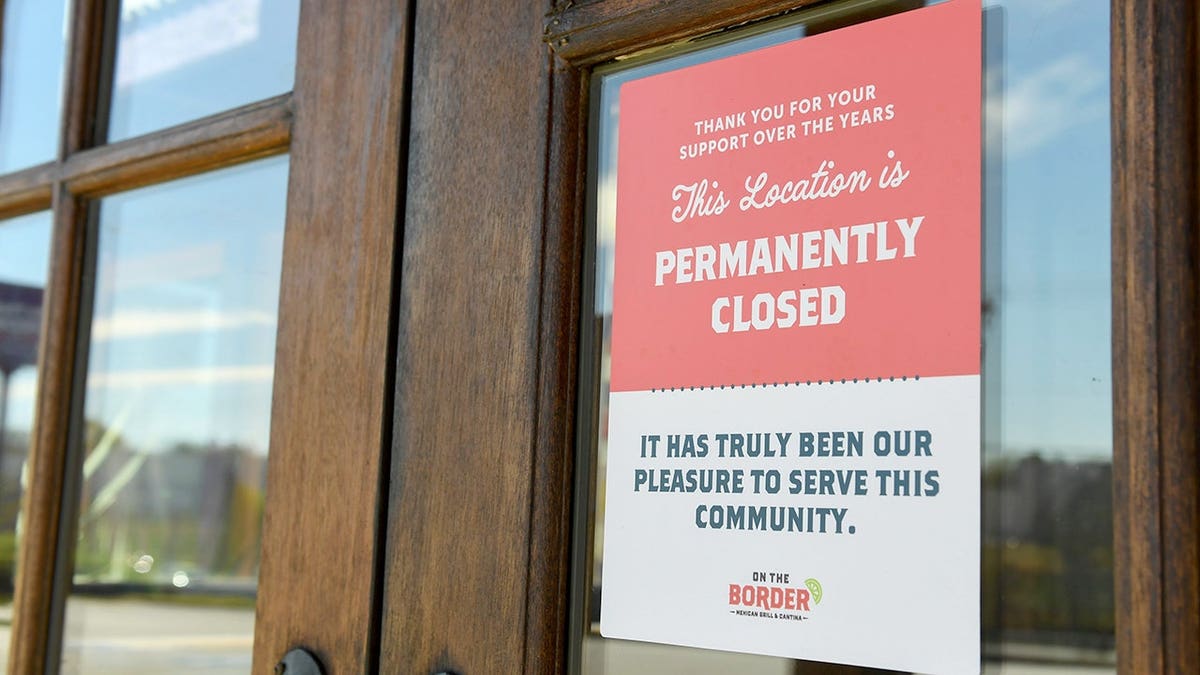 Sign reading 'permanently closed' outside On the Border Mexican Grill & Cantina in Greenville, South Carolina