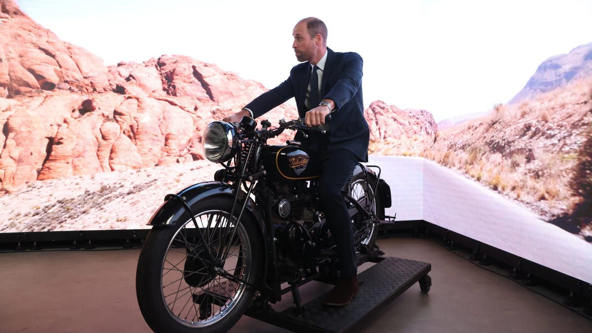 Prince William tries out a motorbike in a virtual production studio at Ulster University in Belfast.