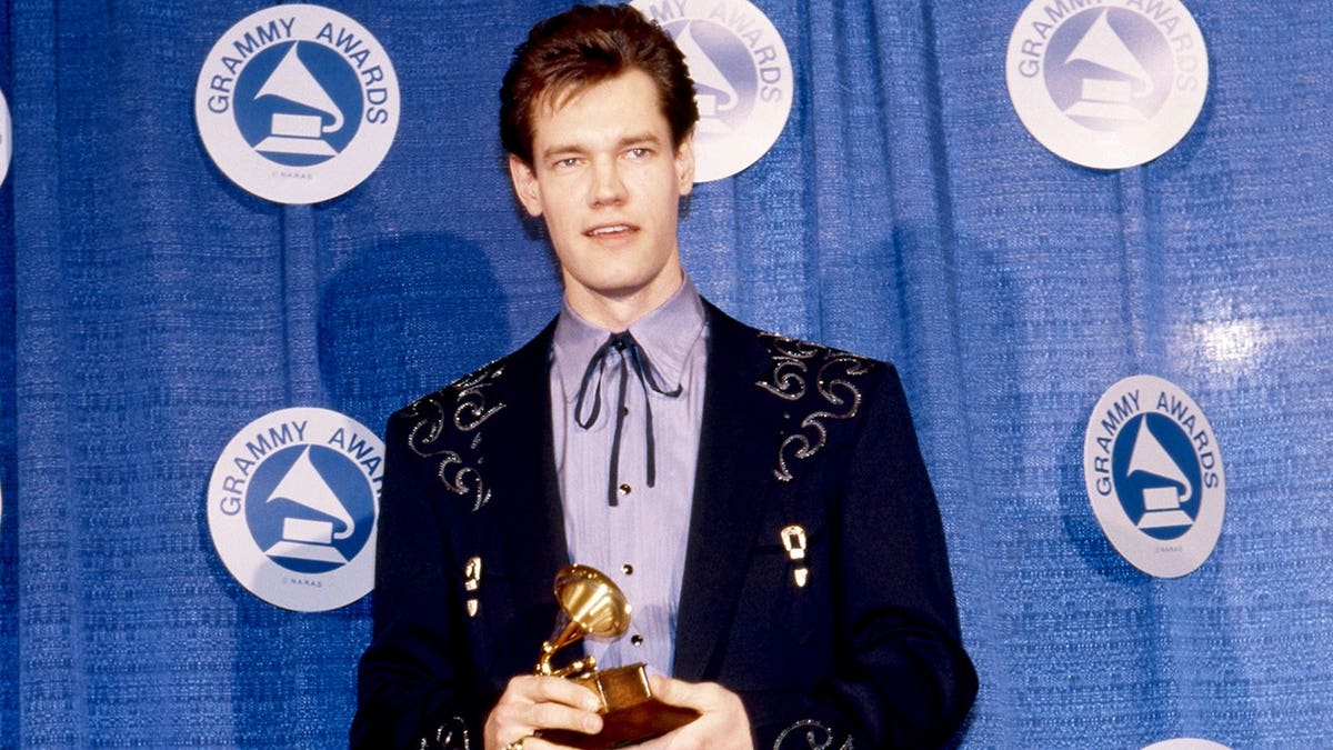Randy Travis holding his Grammy at the Grammy Awards in New York in March 1988.