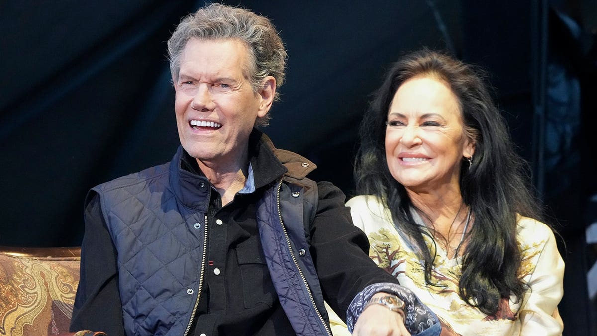 Randy Travis and his wife Mary Travis on stage at the Two Step Inn Festival in Georgetown, Texas in April 2026.