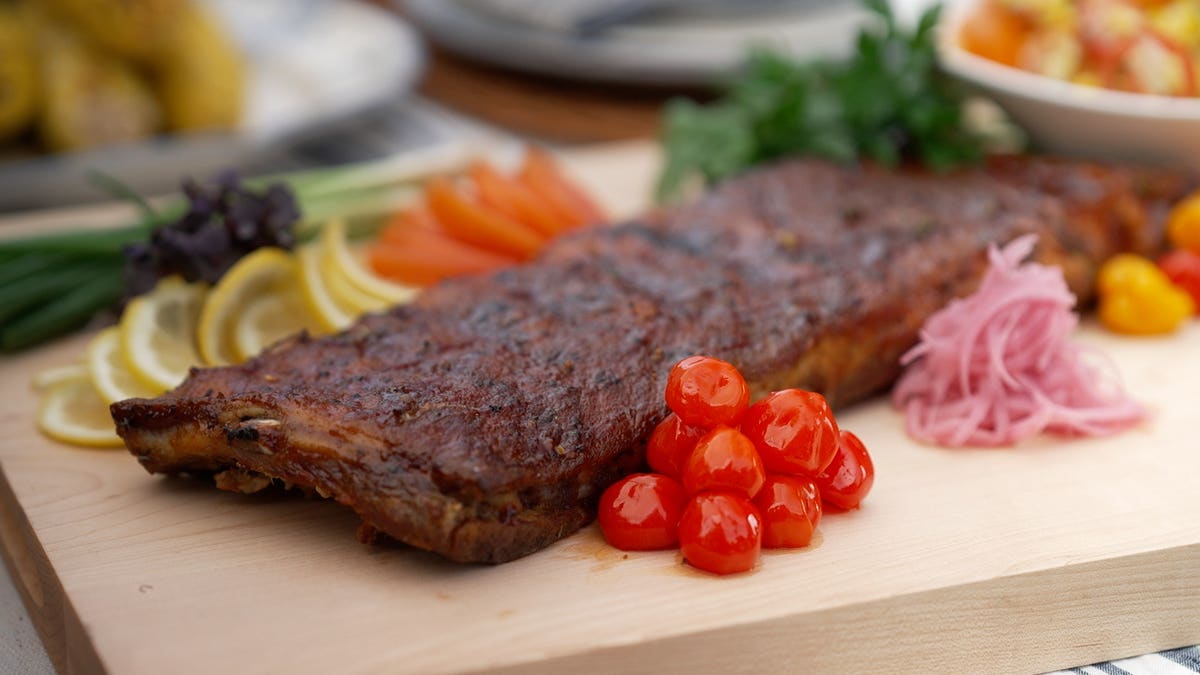 A platter of grilled ribs and seasonal vegetables prepared by Chef André.