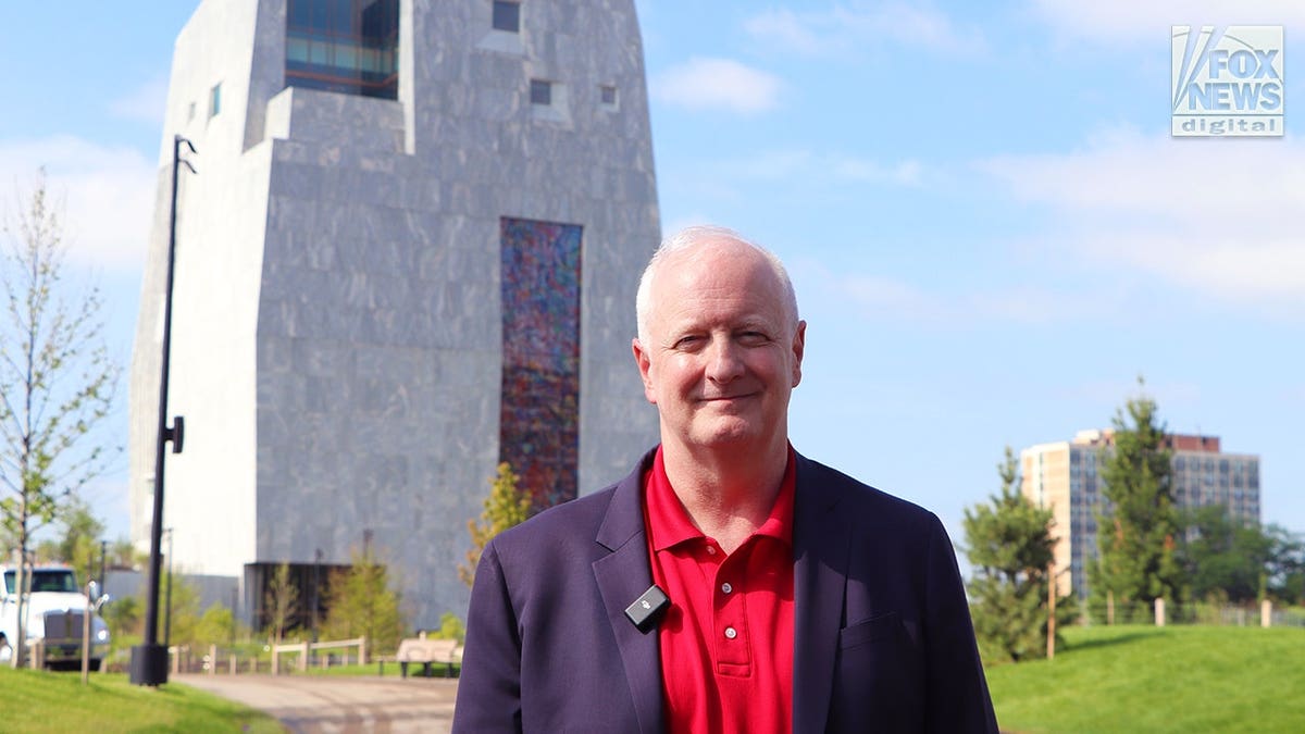 GOP chairman Robert Grogan stands in front of the Obama Presidential Center in Chicago.