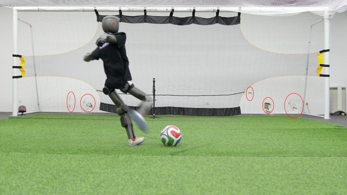 A robot kicking a soccer ball