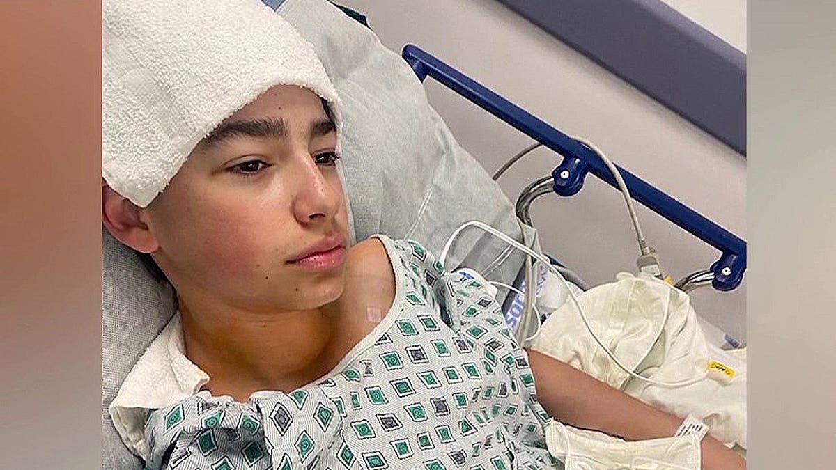 Ryan Martino in a hospital bed
